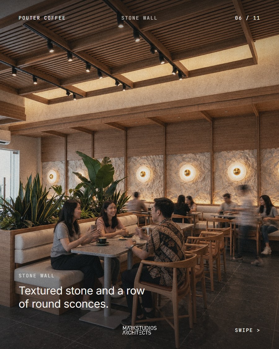 Pouter Coffee, textured stone wall with round sconces